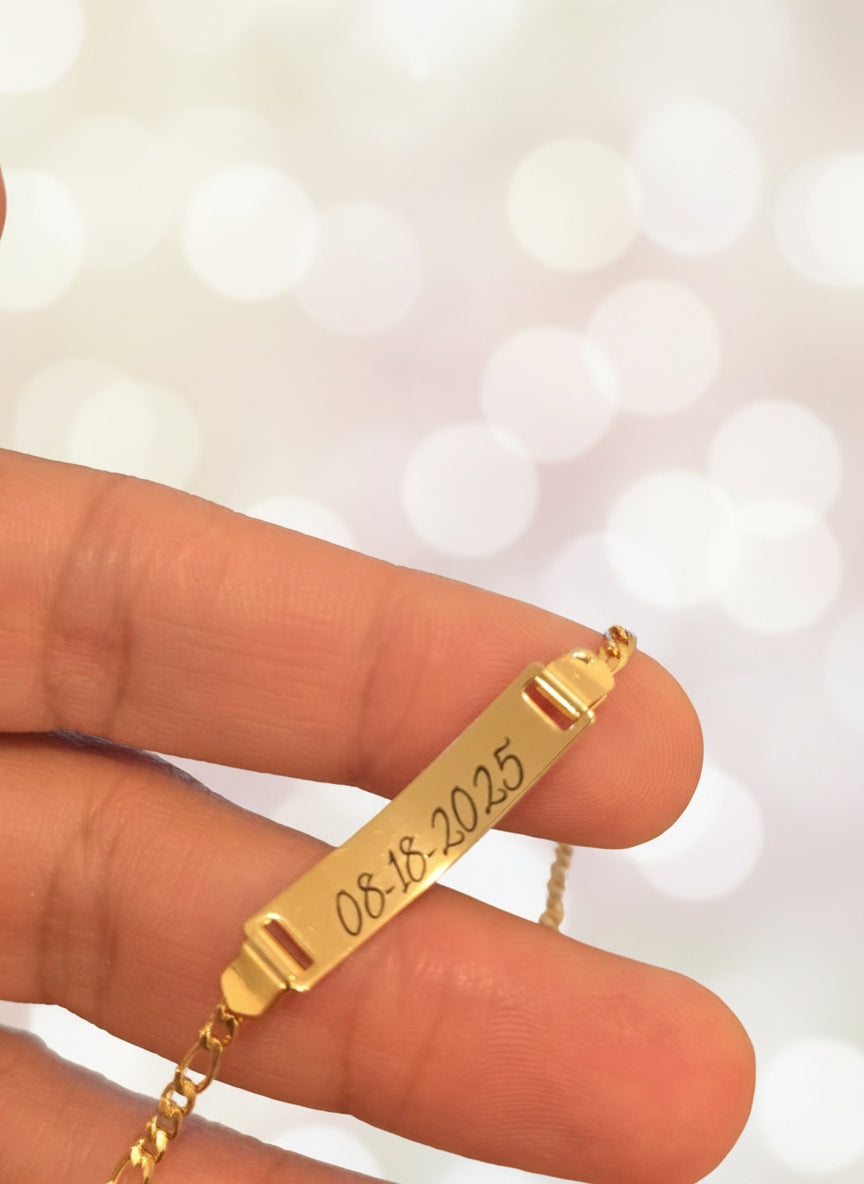 Gold necklace with an engraved date 